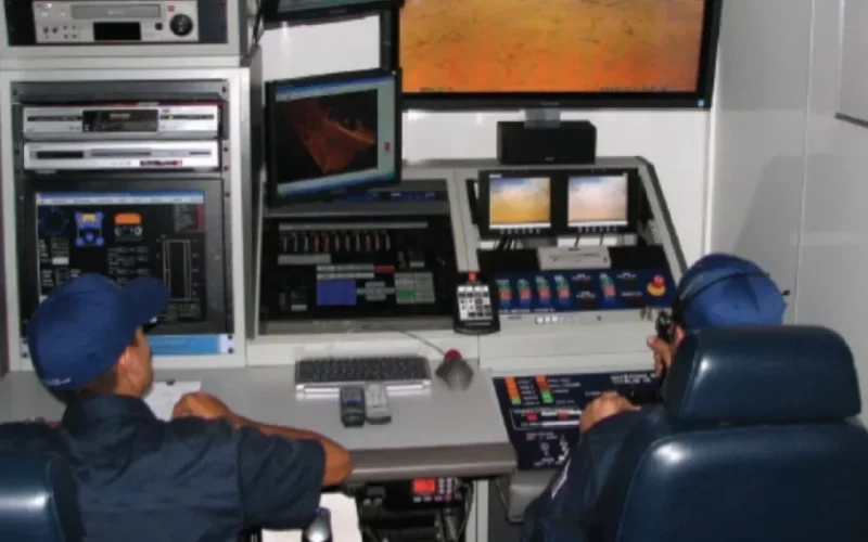 two members at control panel